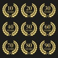 Anniversary laurel wreath icon set. Golden anniversary symbols isolated on black background. 10,20,30,40,50,60,70,80,90 years. Royalty Free Stock Photo